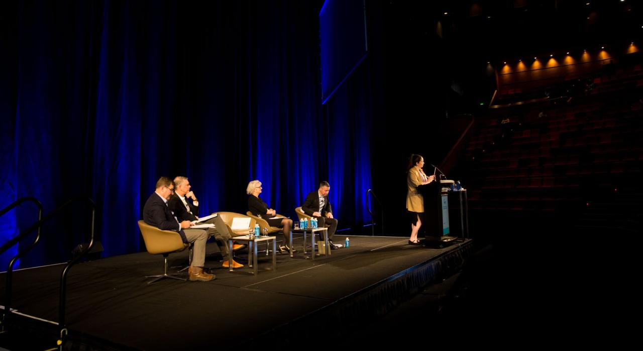 Speaker addressing crowd at National Housing Conference 2023