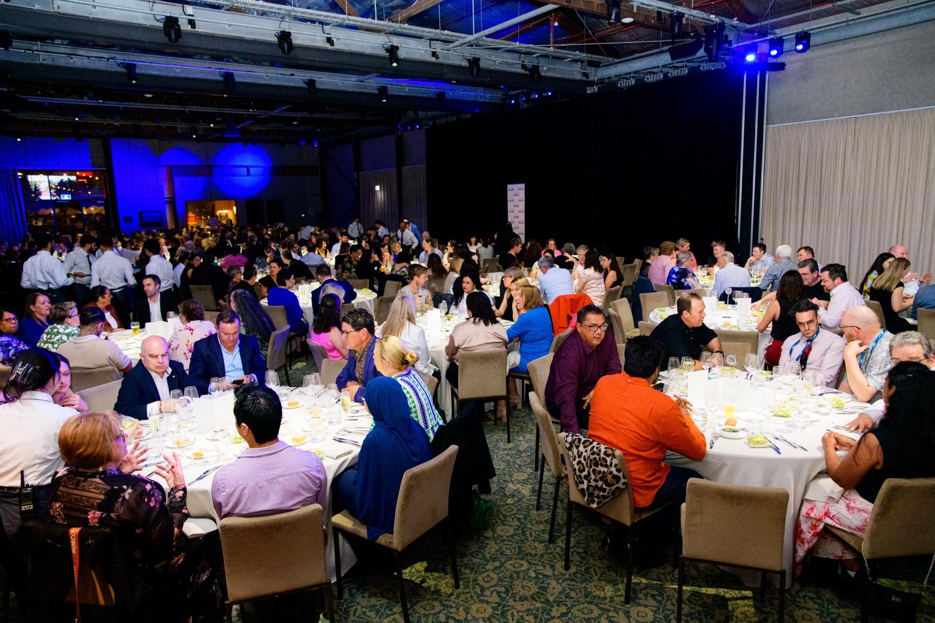 Wide view of conference breakfast event