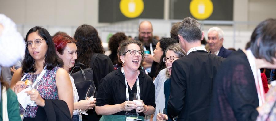 People smiling and laughing at National Housing Conference 2023